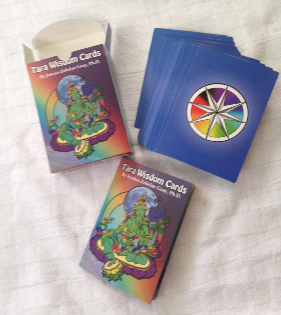 Cards with a rainbow dharma wheel on back and Tara on front